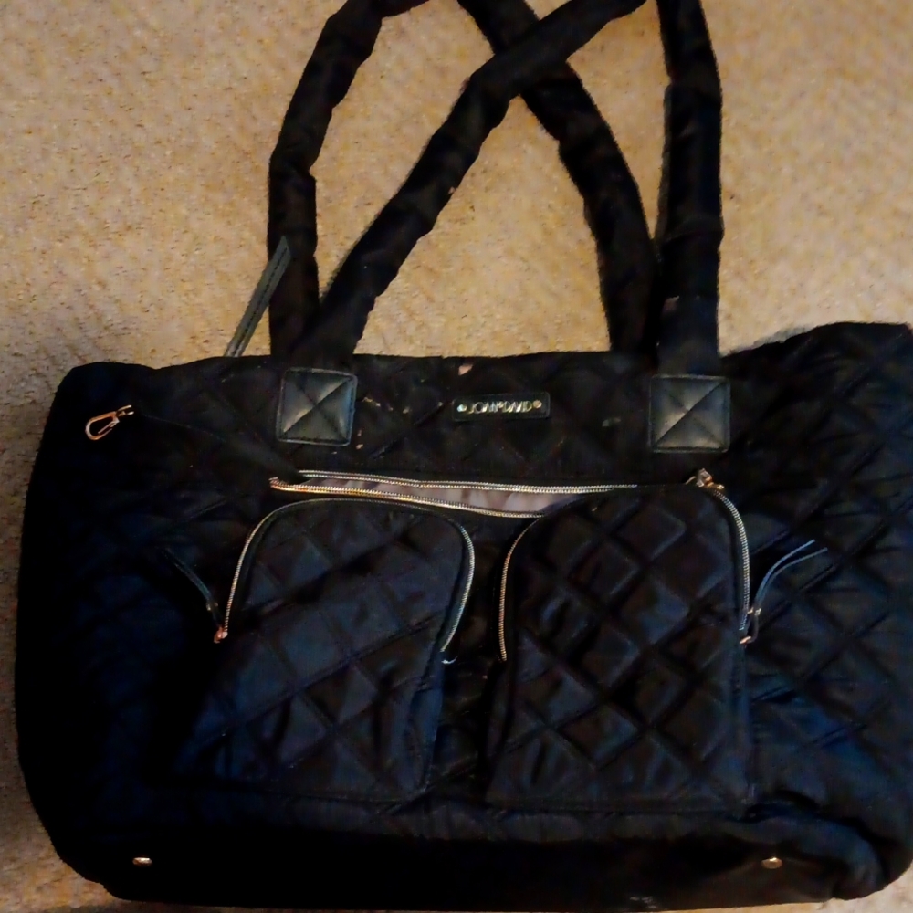 Joan and David big luggage bag
